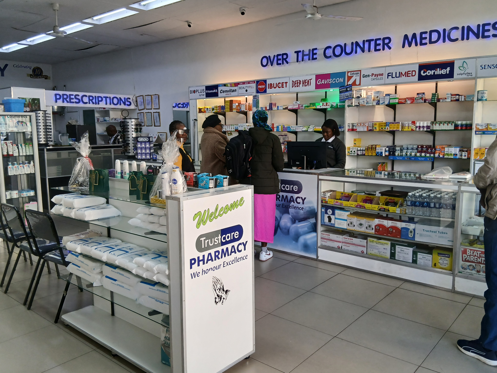 Inside Trustcare Pharmacies — pharmacist counter and healthcare products